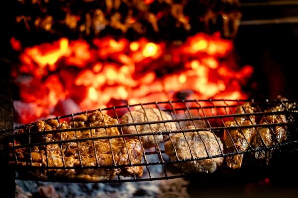 Commercial charcoal broiler and Josper oven in steakhouse kitchen