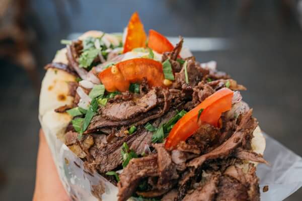 Middle Eastern mashawi and shawarma grill with open flame