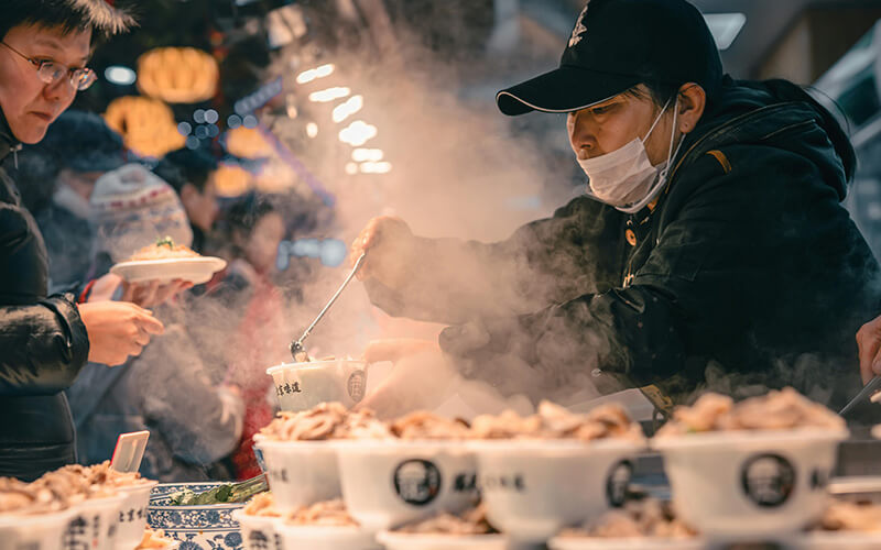 Indoor street food market hall with exposed ductwork and industrial ESP ventilation